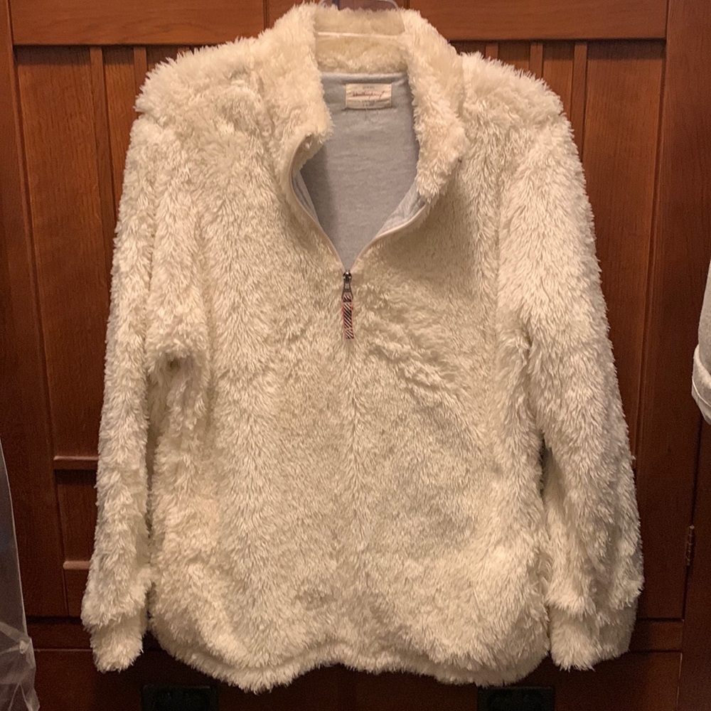 A super warm fleece 1/2 zip pullover with front pockets.